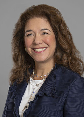 Andrea Schneider smiles at the camera.