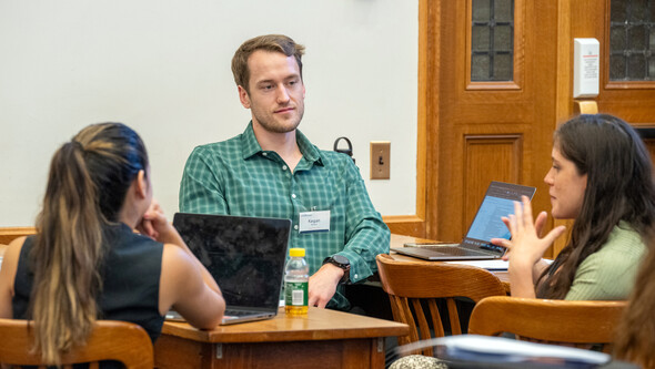 students in conversation in a classroom
