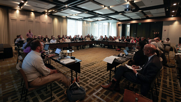 a conference room with attendees at SELA 2023