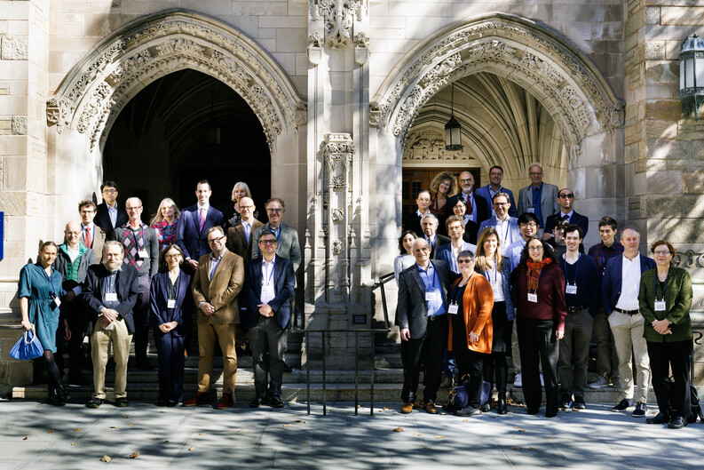 participants from a conference standing on the front steps of Yale Law School