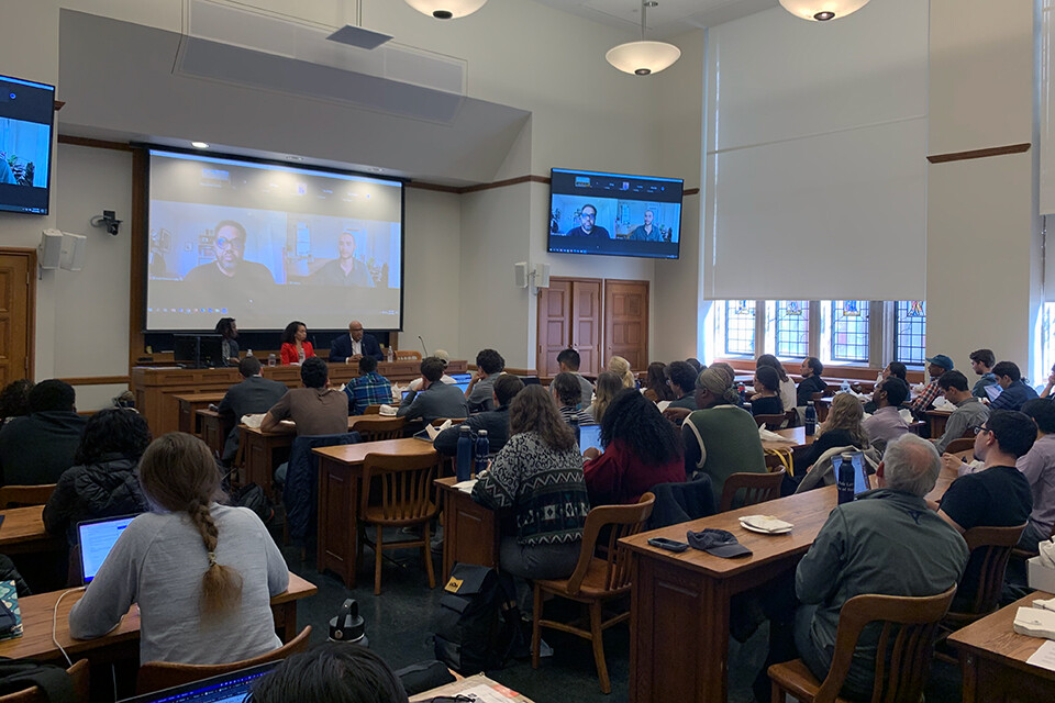 students in a classroom attending a panel discussion