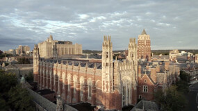 an aerial view of the Law School with dramatic clouds