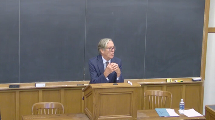 Hugh Kennedy speaking at podium